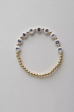 Armband mit goldfarbenen Perlen "Team Bride"