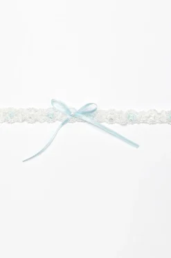 Strumpfband mit blauer Schleife und kleinem Strass-Stein